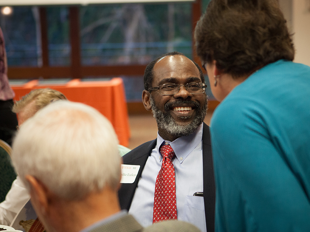 man wearing glasses laughing