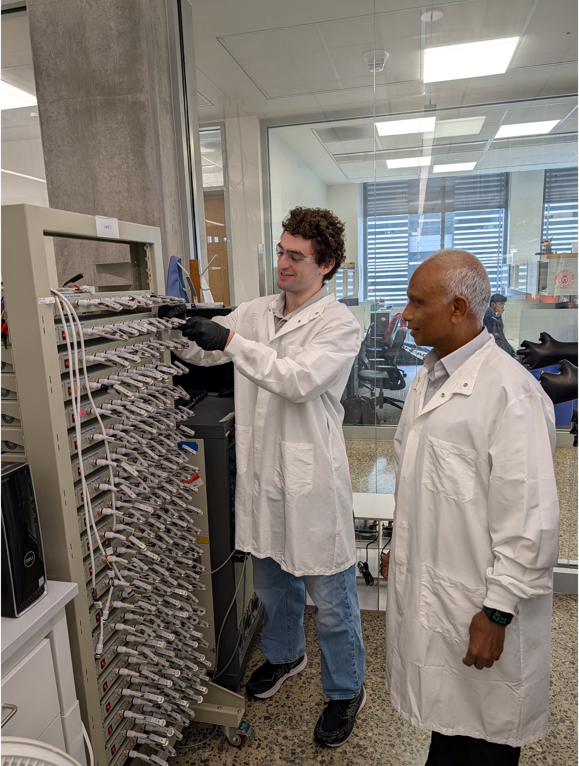 Manthiram and student in lab