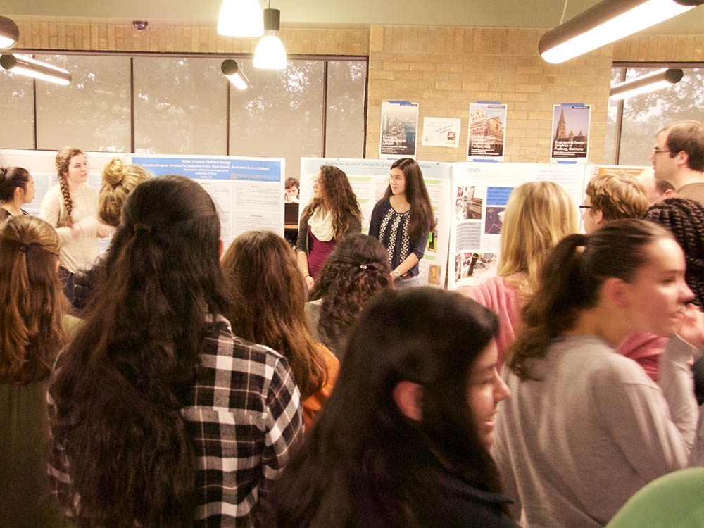 group of students at poster presentation